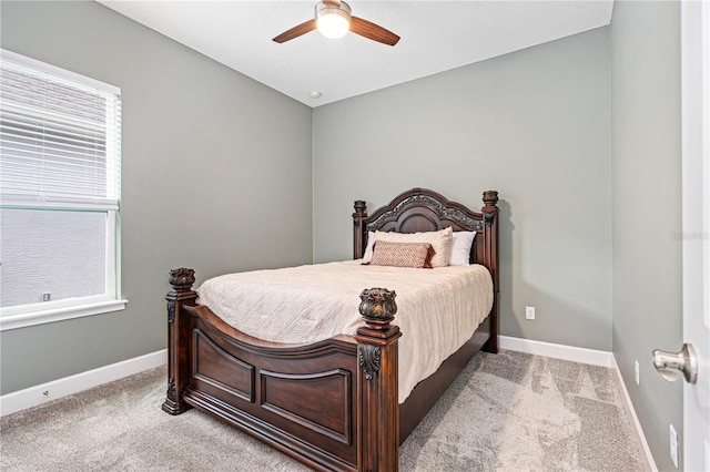 597 Mosaic Blvd, Daytona Beach, FL 32124 - carpeted bedroom with baseboards and ceiling fan