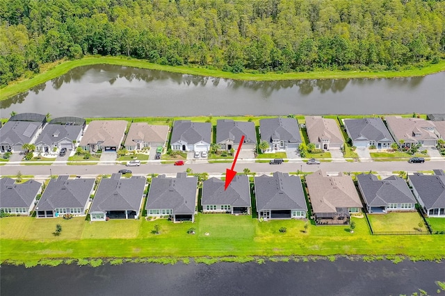 birds eye view of property featuring a water view