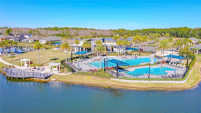 view of swimming pool featuring a water view and a pergola