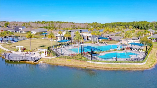 597 Mosaic Blvd, Daytona Beach, FL 32124 - drone / aerial view of a pool and a nearby body of water