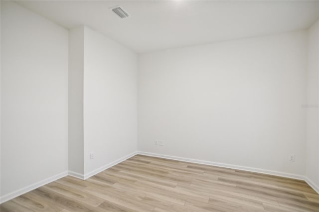 spare room with light hardwood / wood-style floors