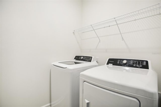 laundry room featuring separate washer and dryer