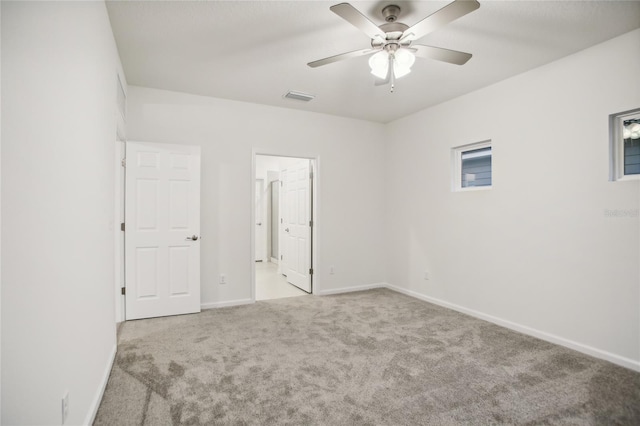 unfurnished bedroom featuring ceiling fan and light colored carpet