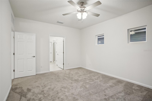 unfurnished bedroom with light carpet and ceiling fan