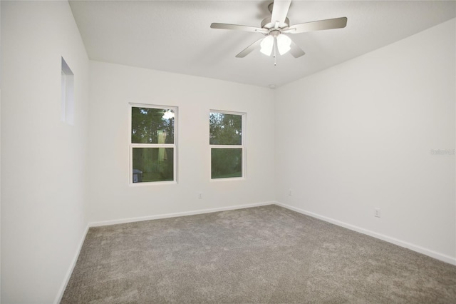 empty room with carpet flooring and ceiling fan