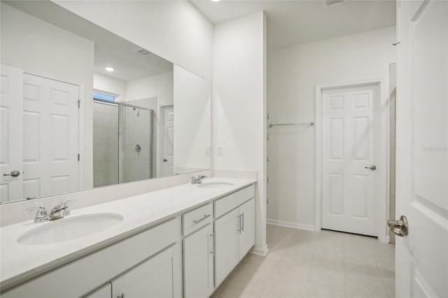 bathroom featuring tile patterned floors, vanity, and an enclosed shower