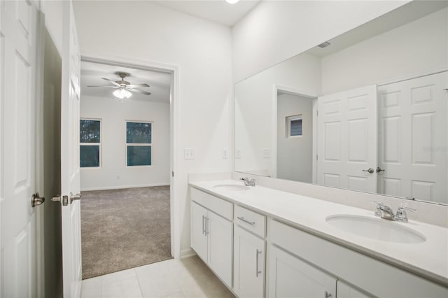 bathroom featuring tile patterned floors, ceiling fan, and vanity