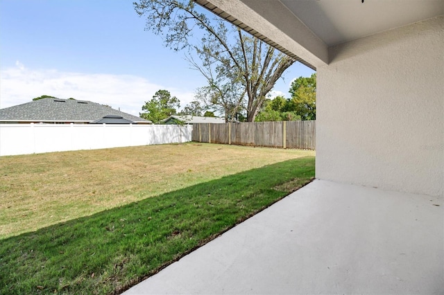 view of yard with a fenced backyard