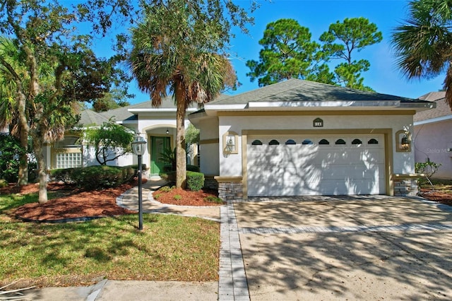 view of front of house with a garage and a front yard