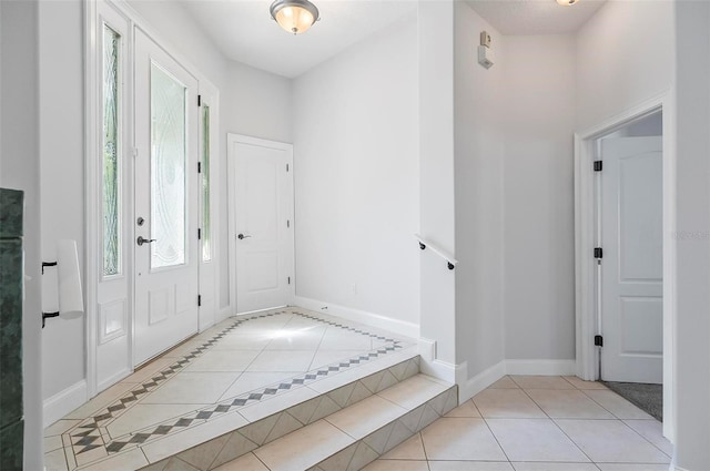 entryway with light tile patterned flooring