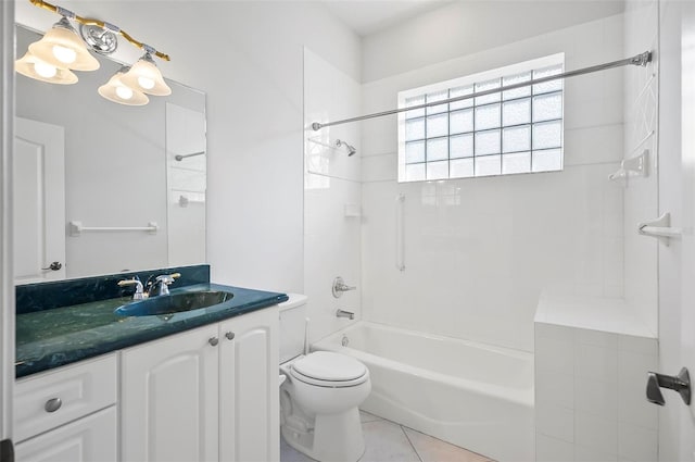 full bathroom featuring tile patterned floors, vanity, toilet, and tiled shower / bath combo