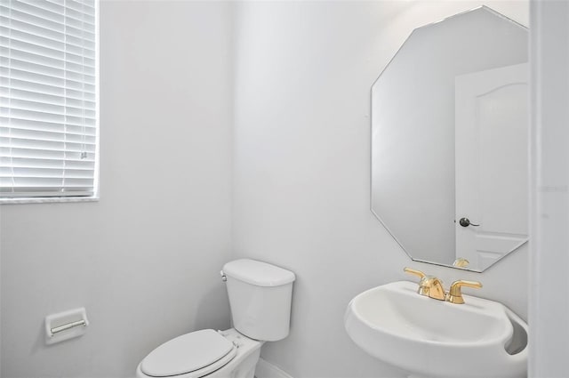 bathroom with toilet and sink