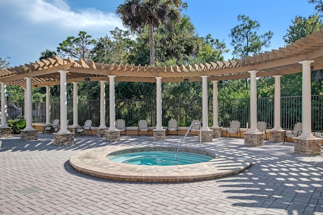 view of pool with a pergola, a patio area, and an in ground hot tub