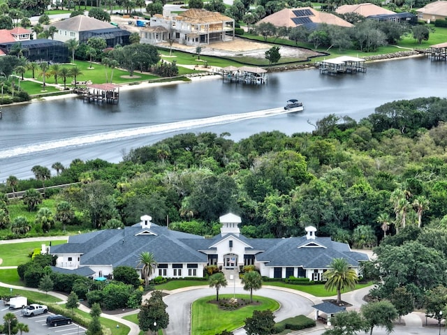 birds eye view of property with a water view