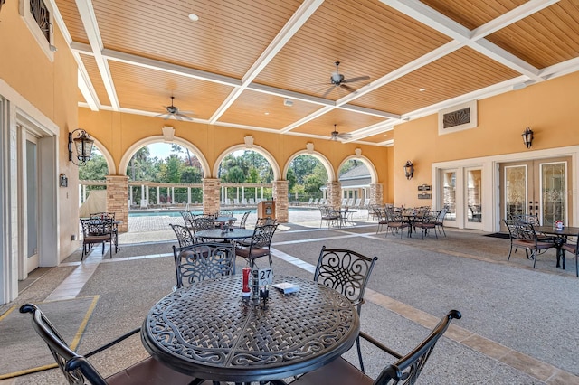 view of patio featuring ceiling fan and a community pool