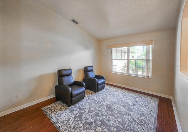 8 Burning Sands Ln, Palm Coast, FL 32137 - sitting room with vaulted ceiling, wood finished floors, and baseboards