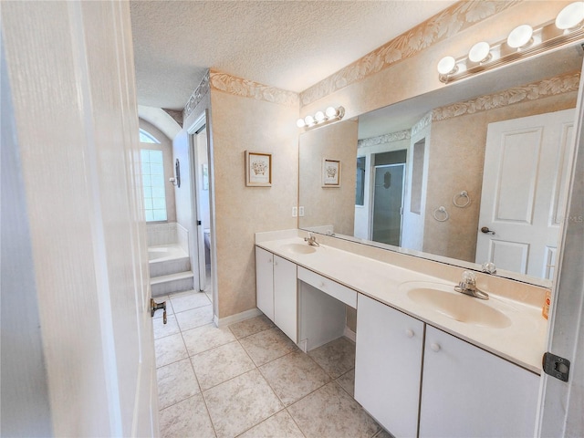 bathroom featuring tile patterned flooring, vanity, independent shower and bath, and a textured ceiling