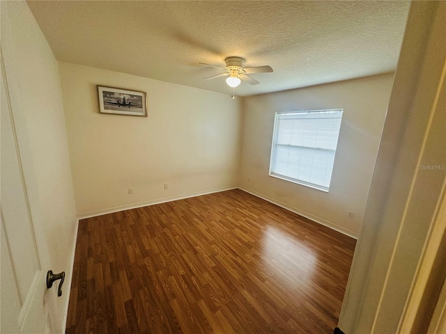 unfurnished room with hardwood / wood-style flooring, ceiling fan, and a textured ceiling