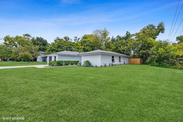 view of property exterior with a yard