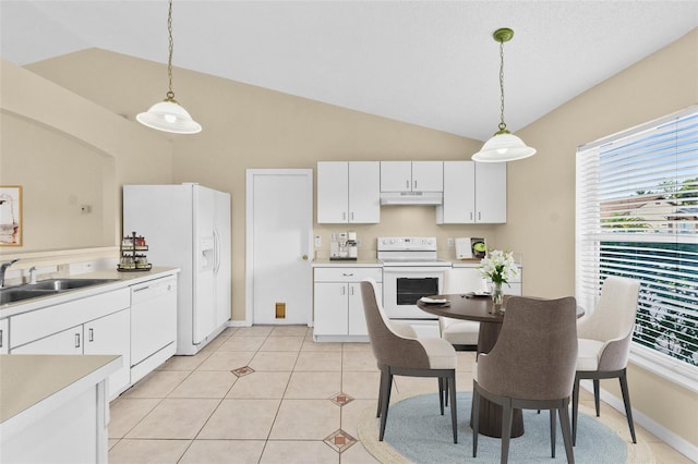 kitchen with white appliances, light countertops, under cabinet range hood, white cabinetry, and a sink