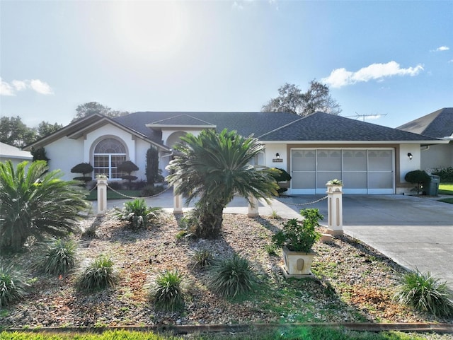 ranch-style house featuring a garage