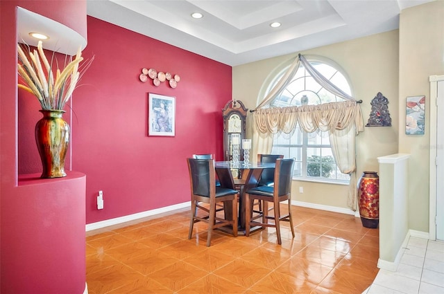 dining room with a tray ceiling