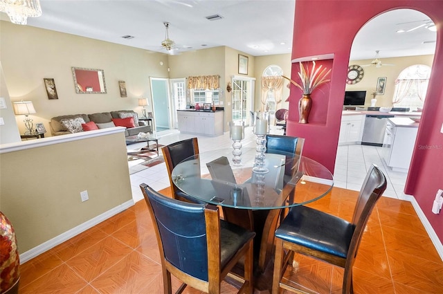 dining space with ceiling fan and light tile patterned floors