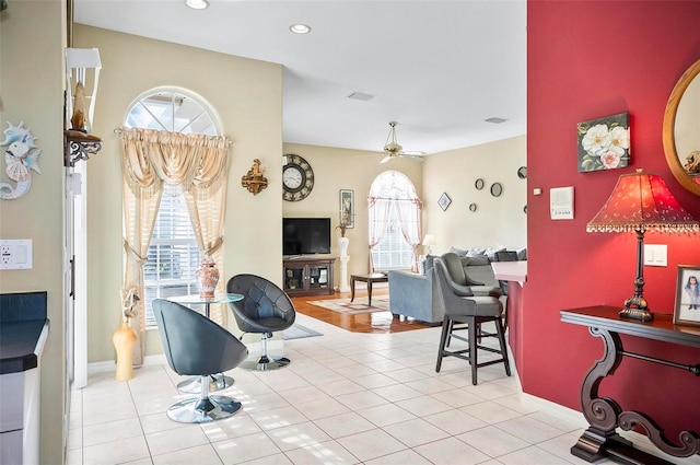 interior space featuring ceiling fan and light tile patterned floors