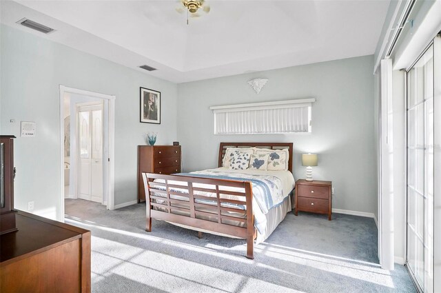 bedroom featuring ceiling fan, a closet, and light carpet