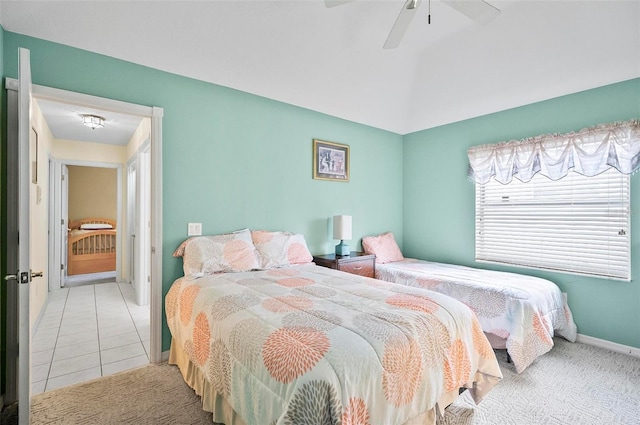 tiled bedroom with ceiling fan