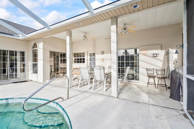 view of patio / terrace with a lanai