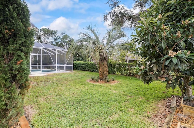 view of yard featuring a lanai