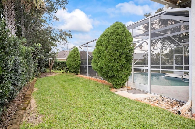 view of yard with glass enclosure