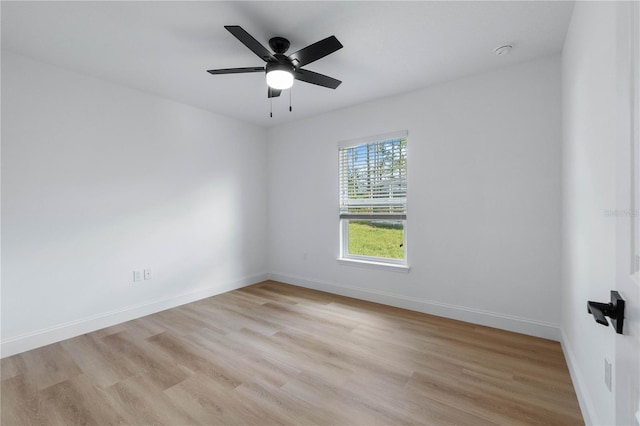 spare room featuring ceiling fan and light hardwood / wood-style flooring