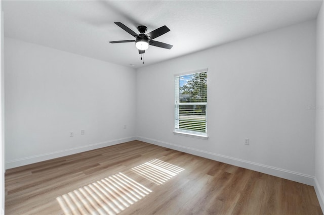 unfurnished room featuring ceiling fan and light wood-type flooring