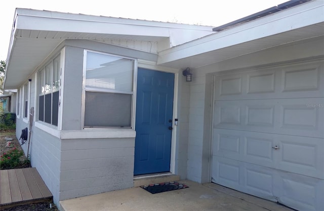 property entrance with a garage