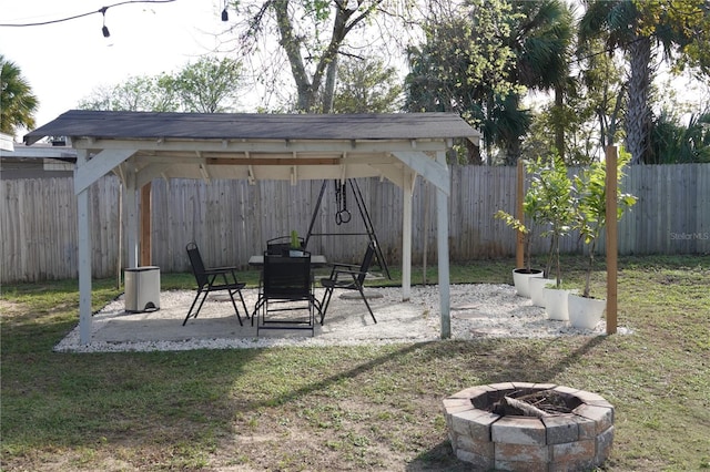 view of yard with a fire pit and a patio area