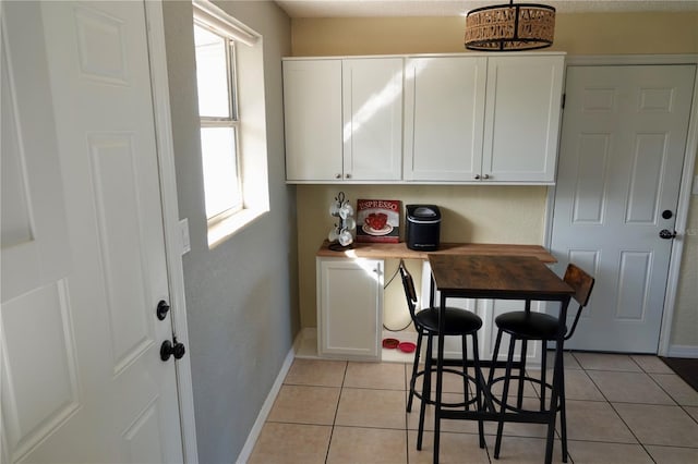 interior space with light tile patterned floors