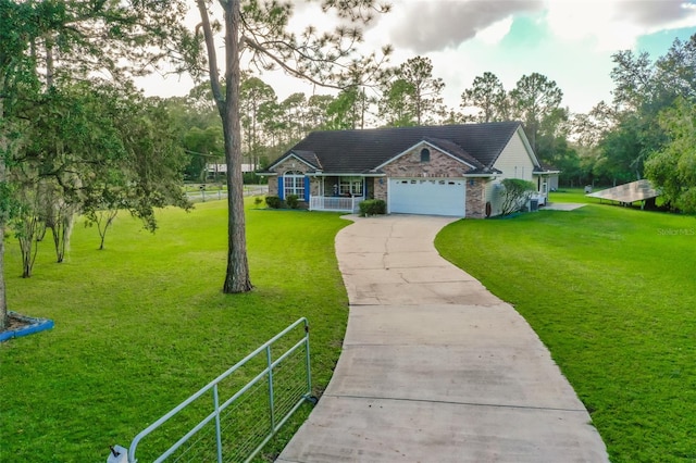 view of front facade with a porch, a garage, and a front lawn