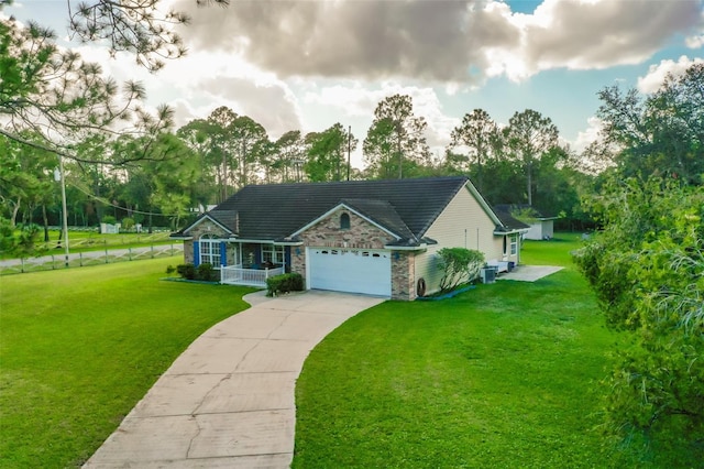 view of front facade with a garage and a front yard