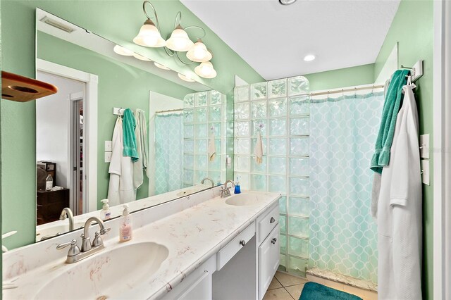 bathroom featuring tile patterned floors, vanity, and a shower with curtain