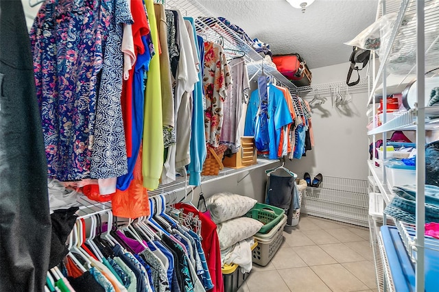 spacious closet with light tile patterned flooring