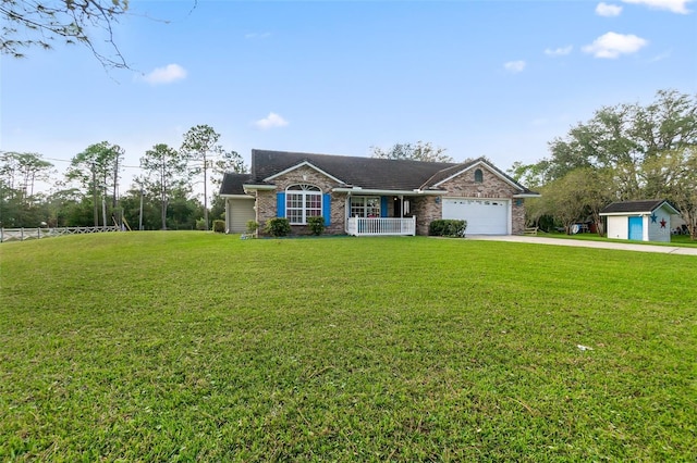 ranch-style house featuring a garage, covered porch, and a front yard