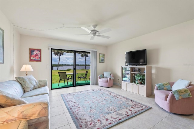 living room with ceiling fan and light tile patterned floors