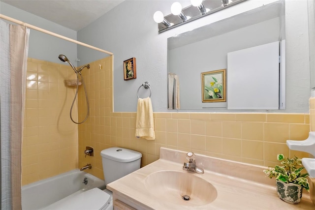 full bathroom featuring shower / tub combo, vanity, tile walls, and toilet