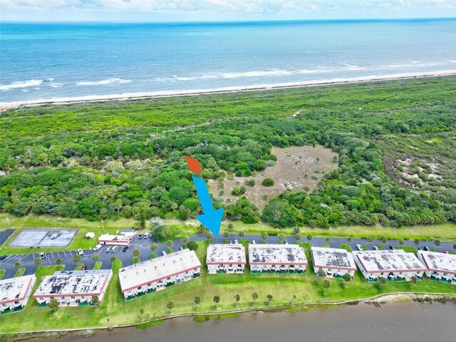 bird's eye view with a beach view and a water view