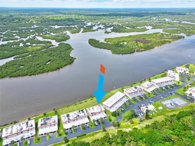 birds eye view of property with a water view