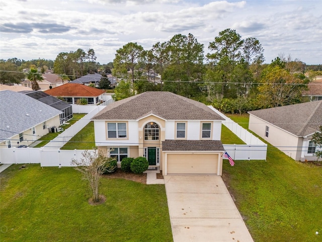 view of front of property featuring a garage and a front lawn