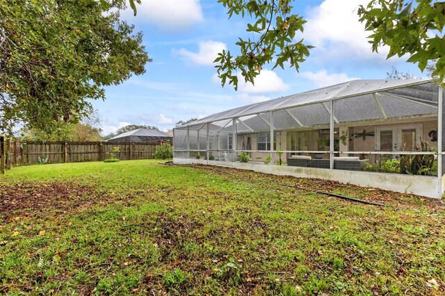 view of yard featuring a lanai