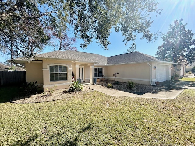 ranch-style house featuring a garage and a front yard